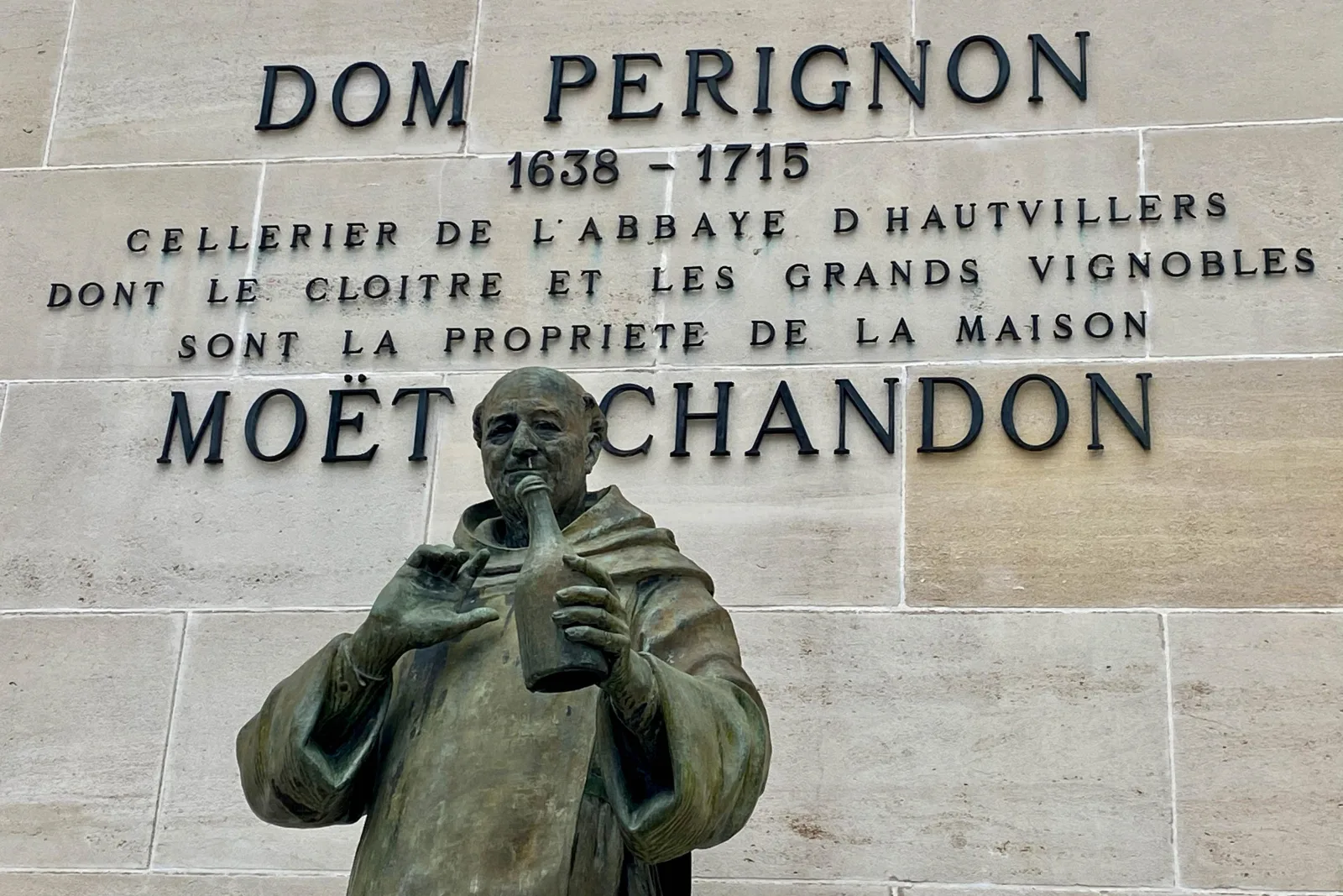 The statue of Dom Pérignon beneath the Moët & Chandon lettering in Épernay