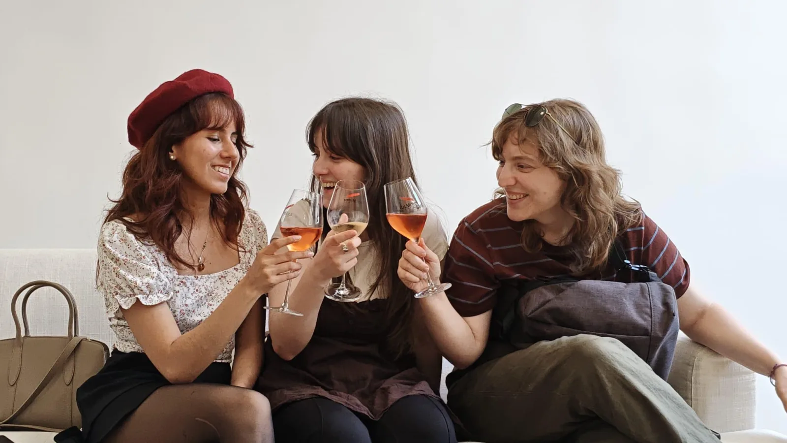Three guests toasting with glasses of rosé Champagne