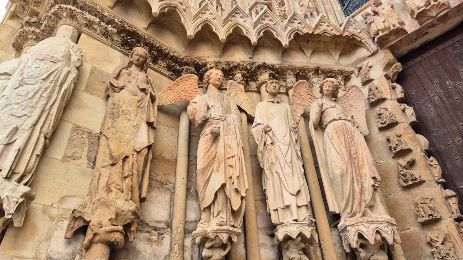 Carved stone figures on the west front of Reims Cathedral